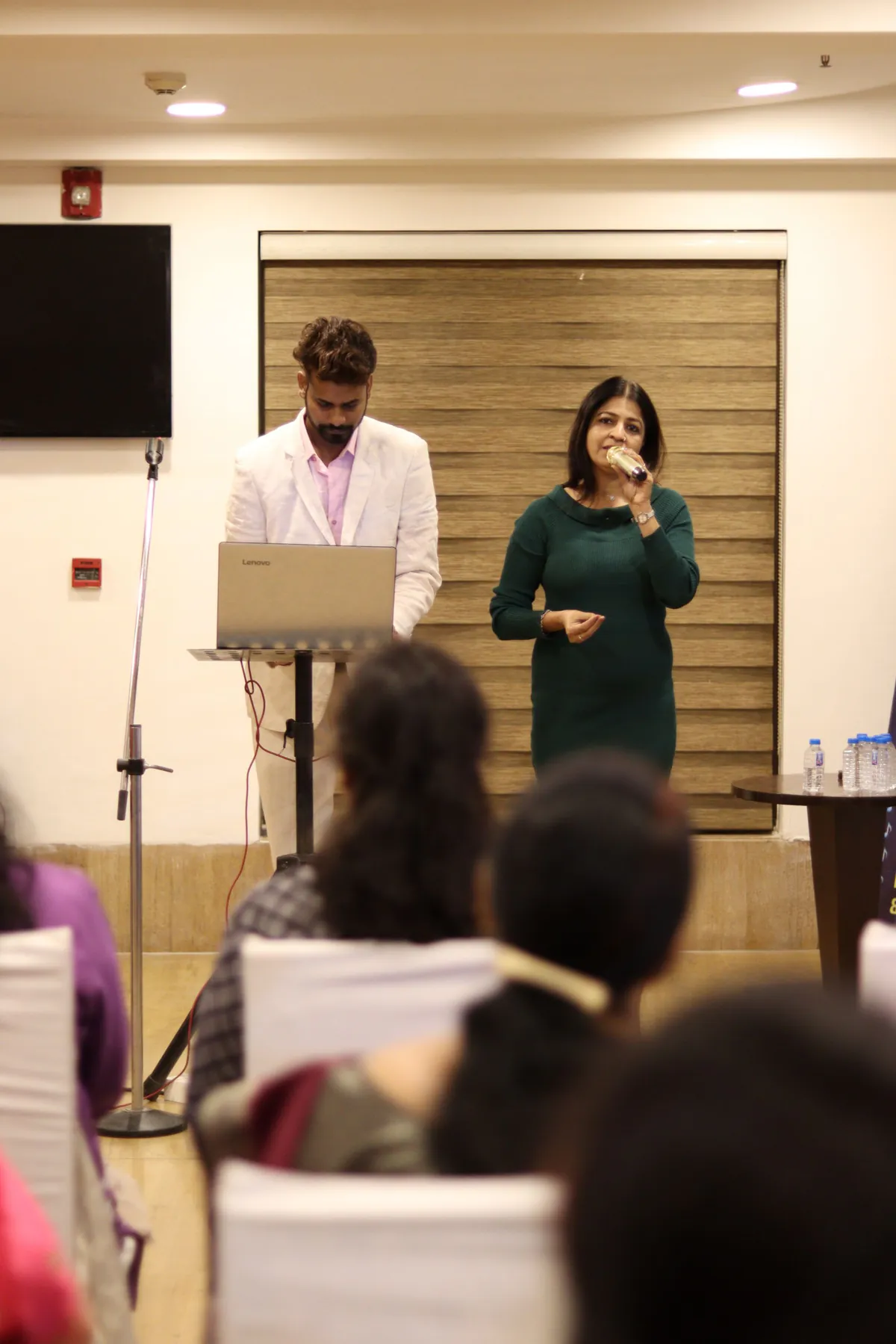 Professionals presenting at a corporate event in Ahmedabad