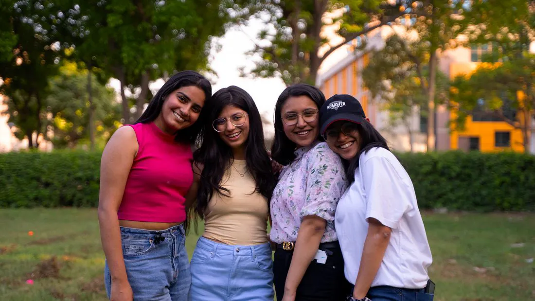 A group of friends smiling together outdoors