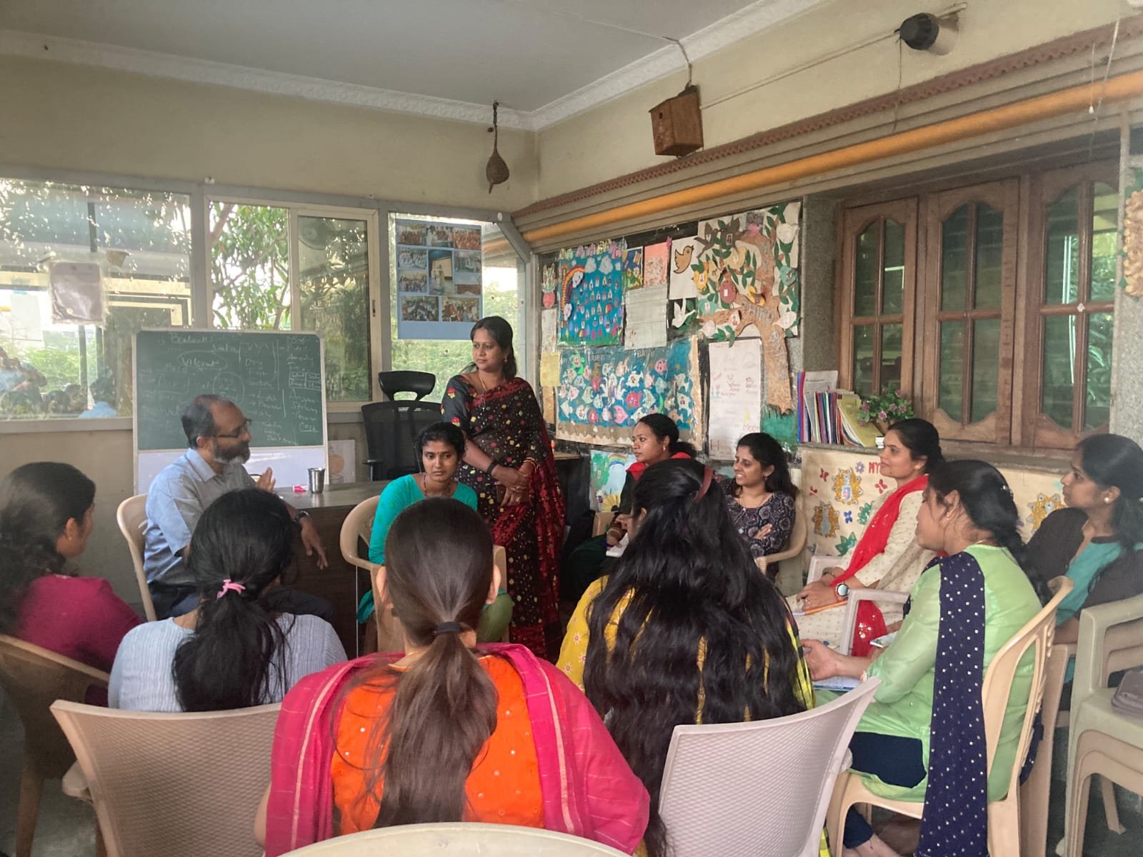 Participants seated in a circle during a group discussion