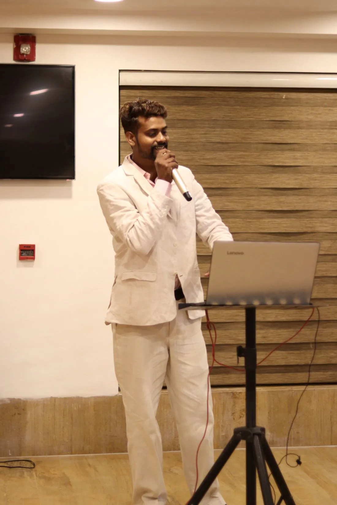 A speaker presenting with a microphone